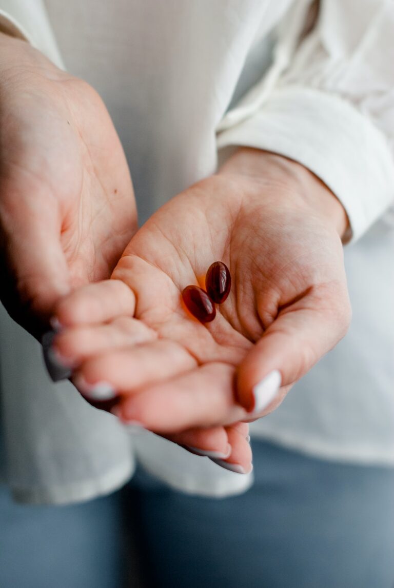 Healthy hands and skin holding vitamins