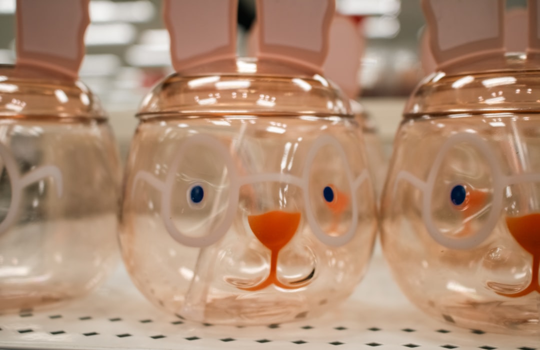 A close-up of Easter-themed bunny-shaped tumblers at Target. by Vitamin Brands Easter bunny-shaped glasses and jars on display.