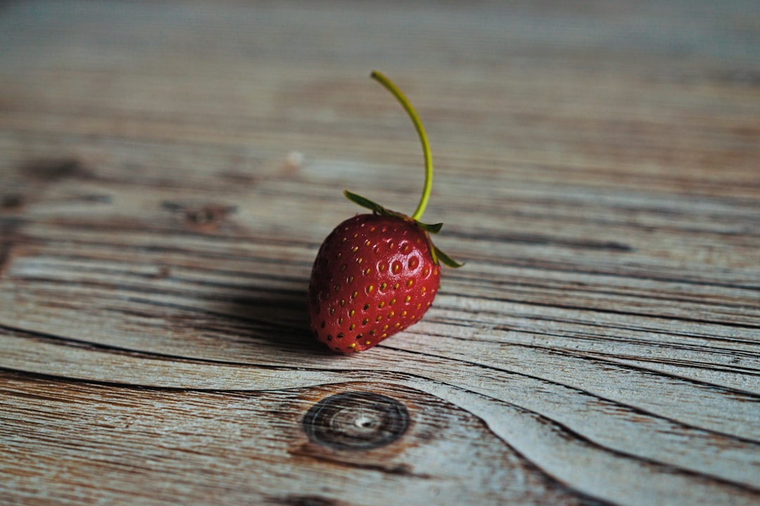 Go to your garden, plant strawberries, wait.
Wait.
Wait.
Well, wait few days, weeks, and enjoy your strawberries.
This one is the first one from my garden. by Vitamin Brands strawberry on wooden surface