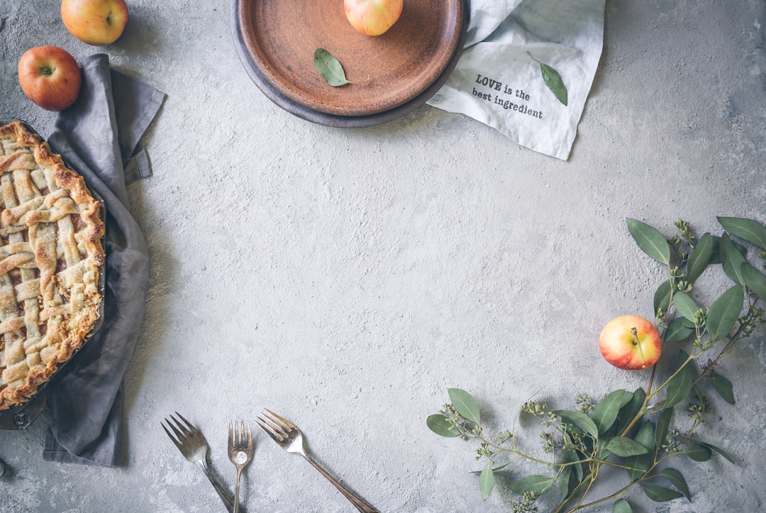 A warm and cozy kitchen is the perfect antidote for autumn. by Vitamin Brands three stainless steel forks near apple